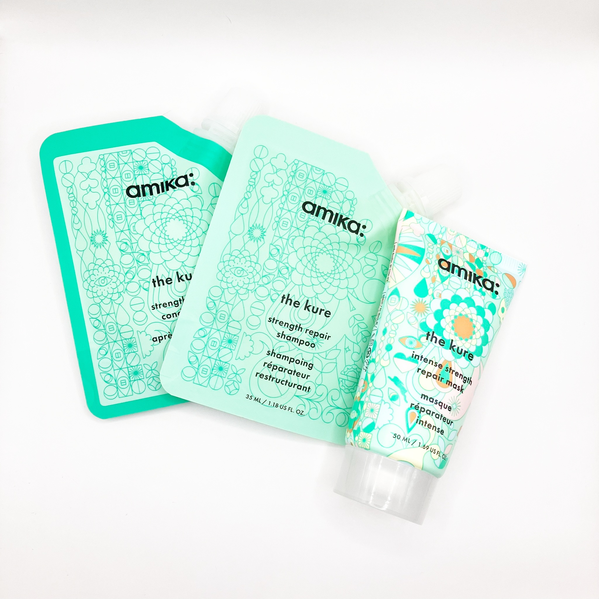 Amika The Kure Strength Repair Trial Set 3 ชิ้น เซ็ตผลิตภัณฑ์ดูแลเส้นผมที่ออกแบบมาเพื่อฟื้นฟูและซ่อมแซมผมที่เสียหายจากการทำสี