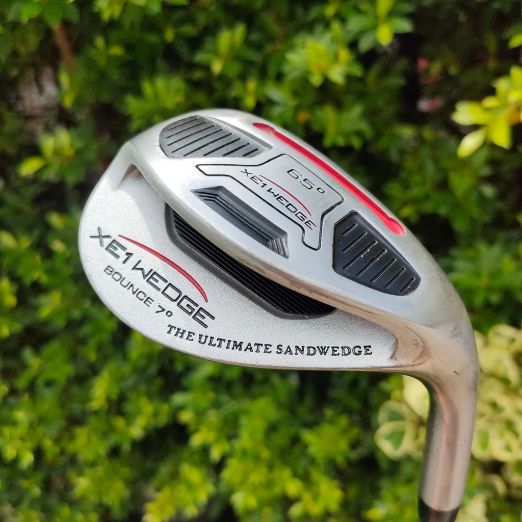 WEDGE XE1 WEDGE THE ULTIMATE SANDWEDGE องศา 65 เบาท์ 7 ก้าน XE1 WEDGE ระเบิดทรายขึ้นแน่นอน แม่น ทะลุทะลวง ชิพง่าย ออแบบพิเศษ!! ไม้กอล์ฟมือสอง ของแท้ BY NakaraLuxurious WEDGE XE1 WEDGE THE ULTIMATE SANDWEDGE องศา 65 เบาท์ 7 ก้าน XE1 WEDGE ระเบิดทรายขึ้นแน่นอน แม่น ทะลุทะลวง ชิพง่าย ออแบบพิเศษ!! ไม้กอล์ฟมือสอง ของแท้ BY NakaraLuxurious